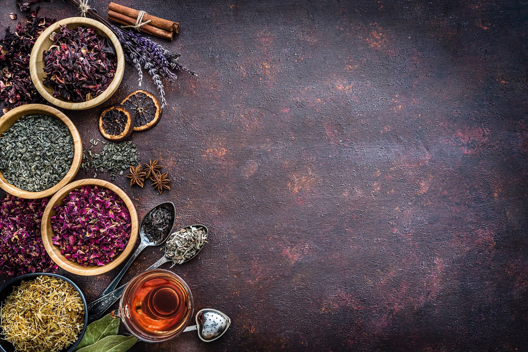 Assorted dried herbs and tea ingredients flat lay